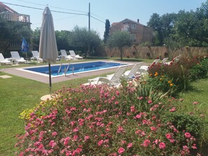 Another look at the pool area and beautiful flowers in vivid colors.