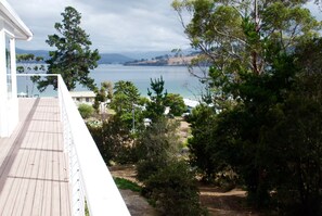 The deck along the side of the house