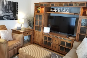 Huge Entertainment Center just brought in  with two matching bookcases that have decor lighting was just installed - Fits 49" 4K Smart TV - Also has two matching end tables as well! Fabulous Addition to this home