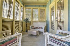 Cozy front porch is just off the master bedroom.