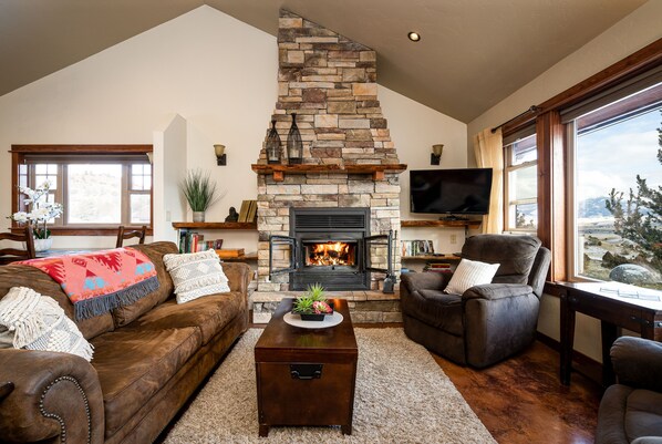 Living Room with wood-burning fireplace.