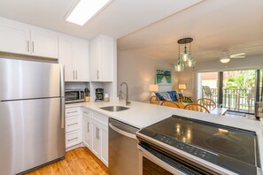 Fully equipped kitchen with modern appliances and a sleek design