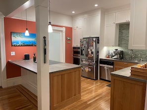 In 2021, our kitchen and dining room was just renovated down to the studs.  It has a new, modern, open feel, yet still retains the style and charm of an old Edwardian.  We have a fully-stocked kitchen, with brand new stove, oven, fridge, and high-end cabinets. 