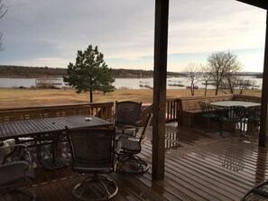 Downstairs Deck with seating up to 30, 2- tables & outdoor livingroom furniture.