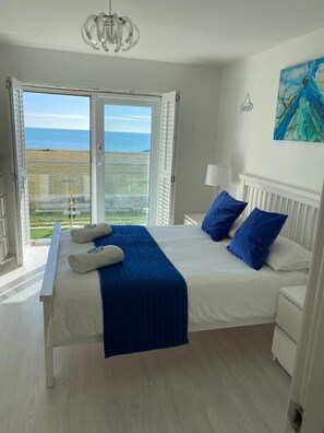 Beautiful master bedroom with en-suite and terrace looking over the sea
