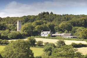 Town Barton with the church, green, and cricket pitch beyond.
Devon holiday home