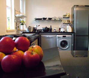 fully equipped  kitchen with granite surfaces