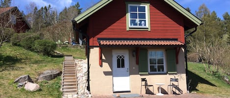 East facade with main entrance and patio