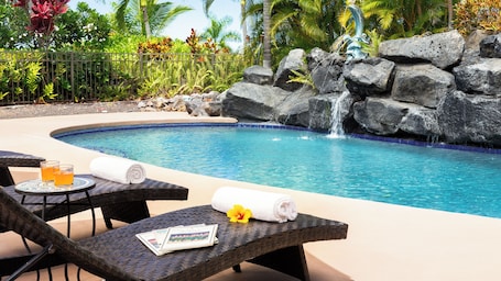 Relaxing pool with a waterfall and fountain