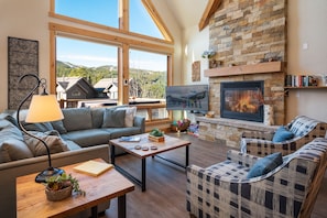 Great room with gas fireplace, flatscreen TV and deck access. Plus AMAZING views!