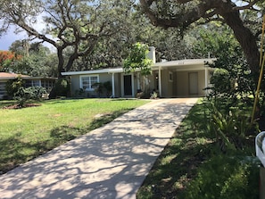 Front of the house with a big front yard.