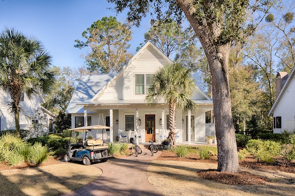 Front of the cottage has a golf cart that the owner allows renters to use.