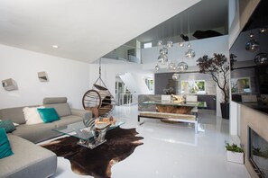 Open floor plan of living room, dining room, and kitchen.