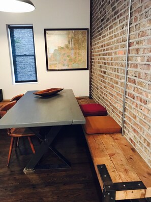 Breakfast/work nook off of kitchen. Reclaimed wood floating benches. 