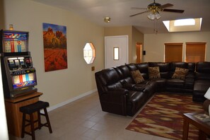 The Living Room Sectional couch and "PLAY $ FREE" Slot MAchine