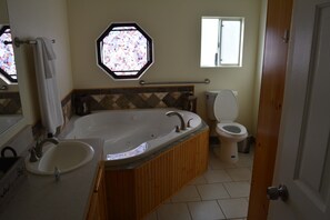 Mater Bathroom with huge Tub. His & Her's Sinks
