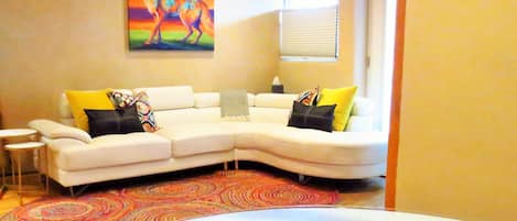 Enjoy lounging on the large sectional. Enjoy a meal in the lovely dining area.