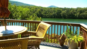 Oversized deck, marble table with umbrella, sits four