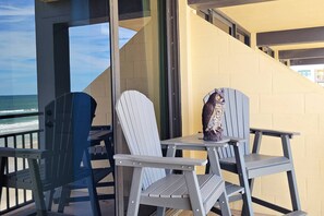 High top chairs with center table to easily take in the views over top of the balcony.