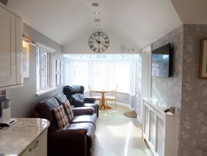 Through lounge leading the conservatory and dining area