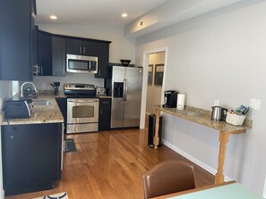Updated fully equipped kitchen. Granite Counters, stainless steel appliances.