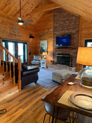 Great room with a great view!  Doors lead to wrap around porch & deck. 