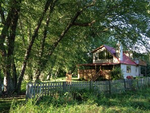 View of the Tranquil Chalet from the meadow during summer.