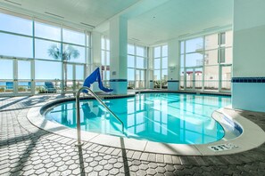 Large indoor pool with beach views