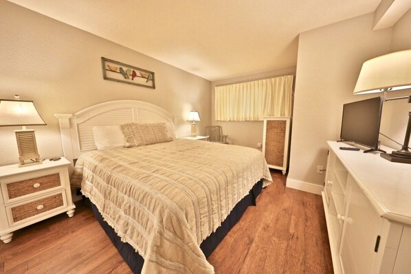 Master bedroom with king sized bed and flat screen T.V.