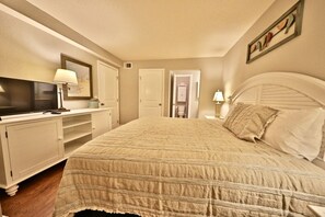 Master bedroom with king sized bed and flat screen T.V