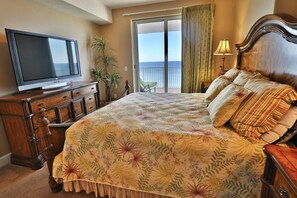 Huge flatscreen TV in the master bedroom.