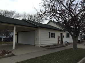 Rear of the home car port and garage