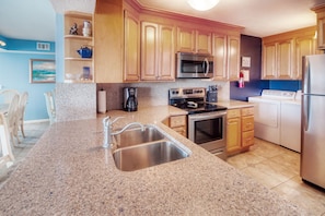 Kitchen - Don’t feel like dining out? The kitchen is fully equipped to enjoy all your favorite meals from home.