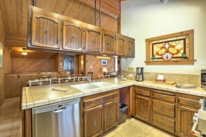 Step inside and enter the fully equipped kitchen.