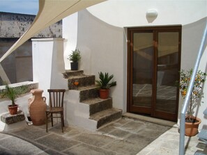 Lower private roof terrace with french doors to the kitchen