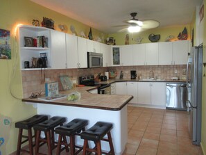 View into fully-equipped Kitchen. All stainless steel appliances. Blender/coffee