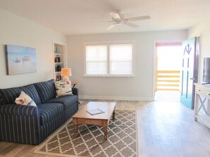 Living area with door to private covered porch