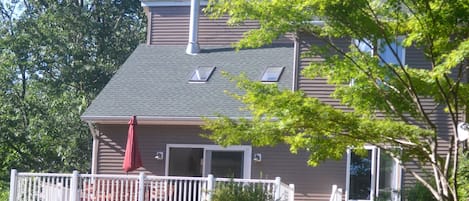 Set back from the street,  enjoy the spacious deck that overlooks front yard.