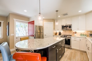 Great kitchen with beautiful quartz countertops and a walk-in pantry. 