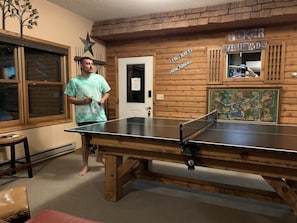 Switch out the pool table to a game of ping pong.
