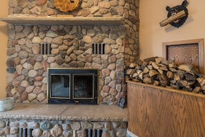 Wood burning stone fireplace with plenty of firewood provided in game room! 