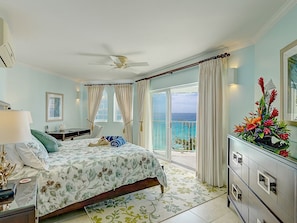 Master Bedroom. Open the patio door and enjoy the pleasant rhythm of the waves. 