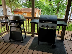 Two gas grills: One is a regular style grill, one is a griddle-style grill