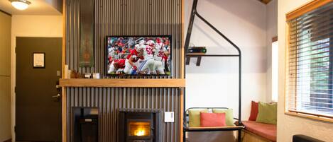 Living Room with 55" Smart TV and sleeper sofa.