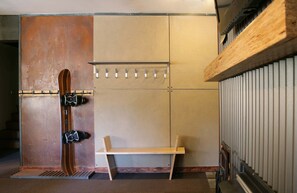 Entry wall with lots of storage for snowboards & Skies.