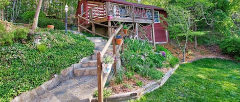 Stone paths and lovely gardens surround this vacation cottage