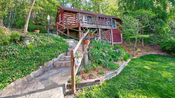 Stone paths and lovely gardens surround this vacation cottage