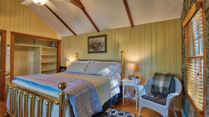 King Size big brass bed and open closet for easy storage