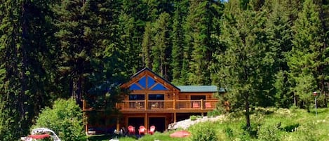 Enjoy our roomy upscale rustic log home with private beach on the lake