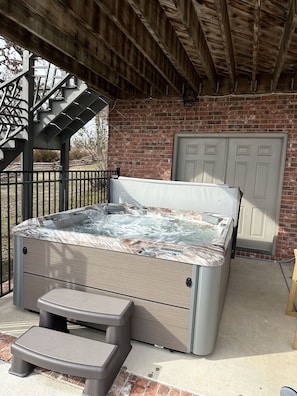 Sit in your private hot tub after soaking in the pool!